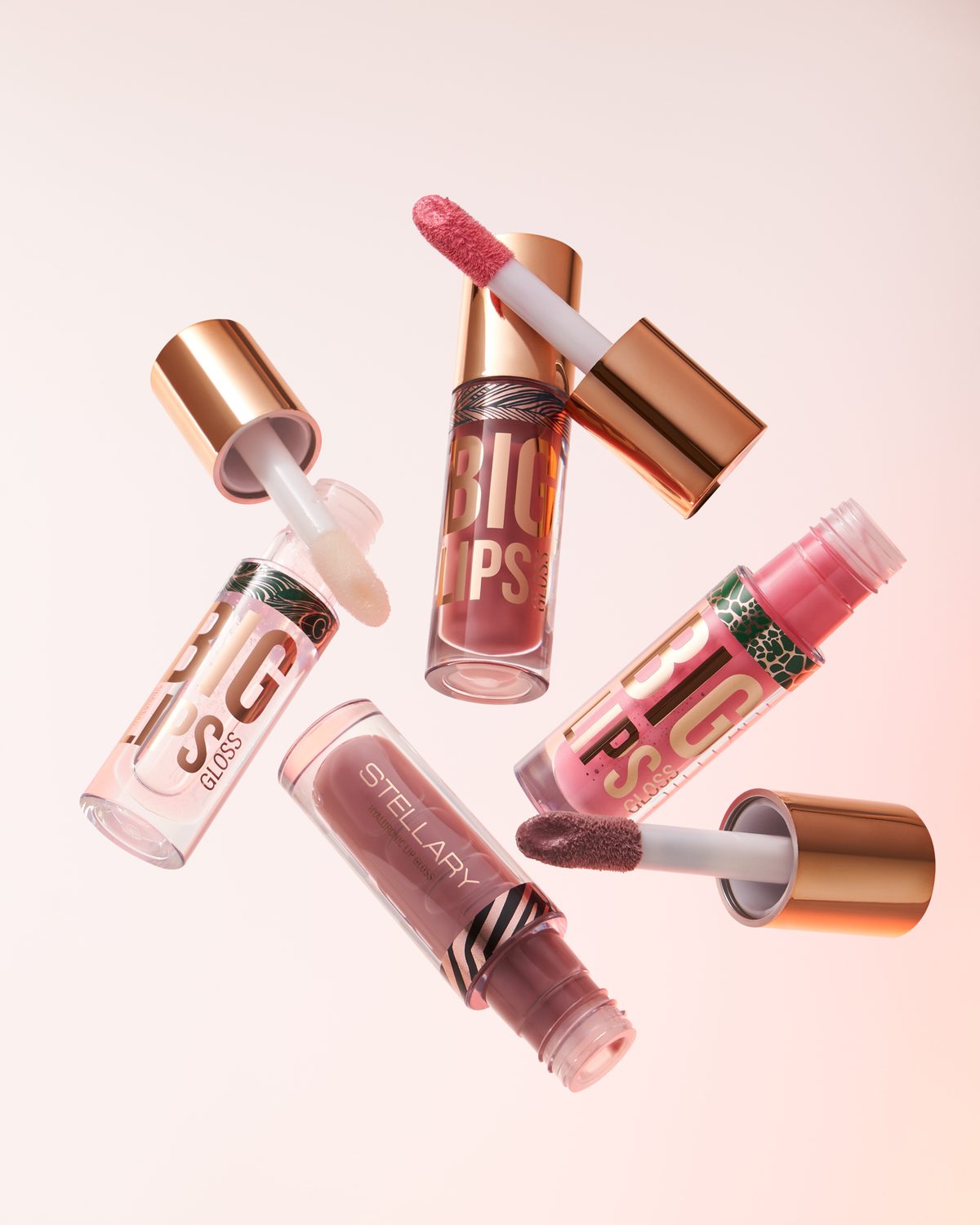 Floating lip gloss tubes with gold caps